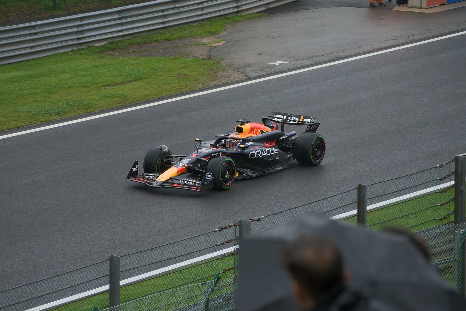 Max Verstappen's Red Bull RB20 on intermediate tyres on a wet track at Spa-Francorchamps during the 2024 Belgian Grand Prix weekend