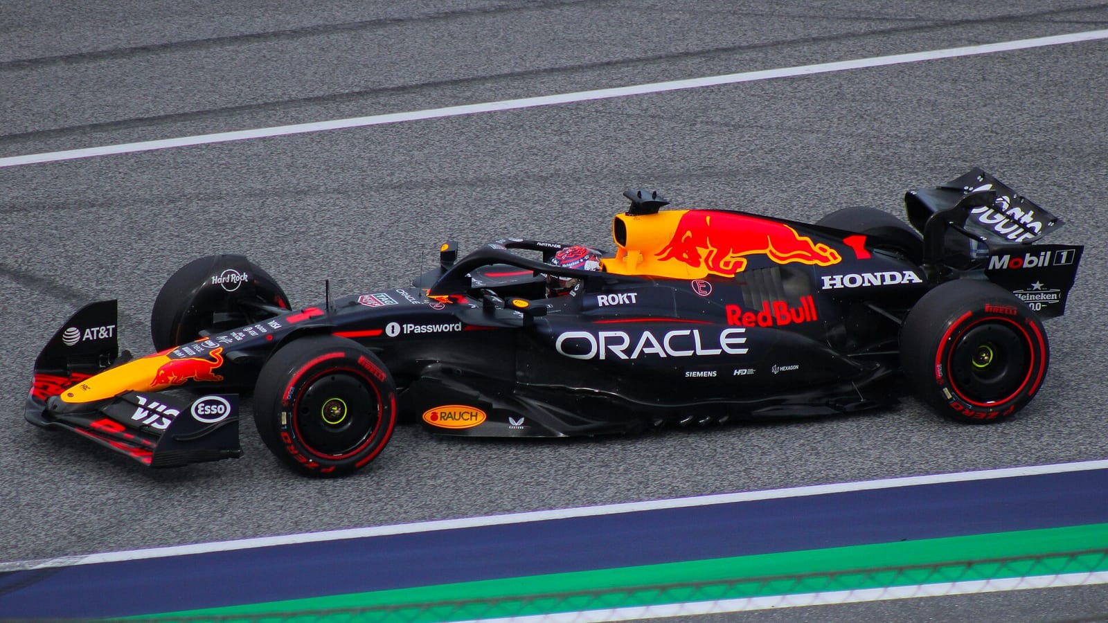A dark blue Red Bull RB21 with the number 1 on track at the Red Bull Ring during the 2025 Austrian Grand Prix weekend