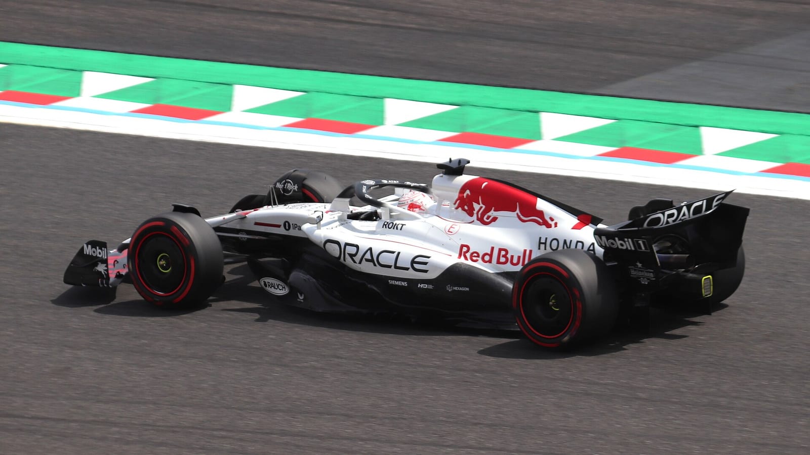 Max Verstappen in the white Red Bull RB21 on track at Suzuka during third practice for the 2025 Japanese Grand Prix