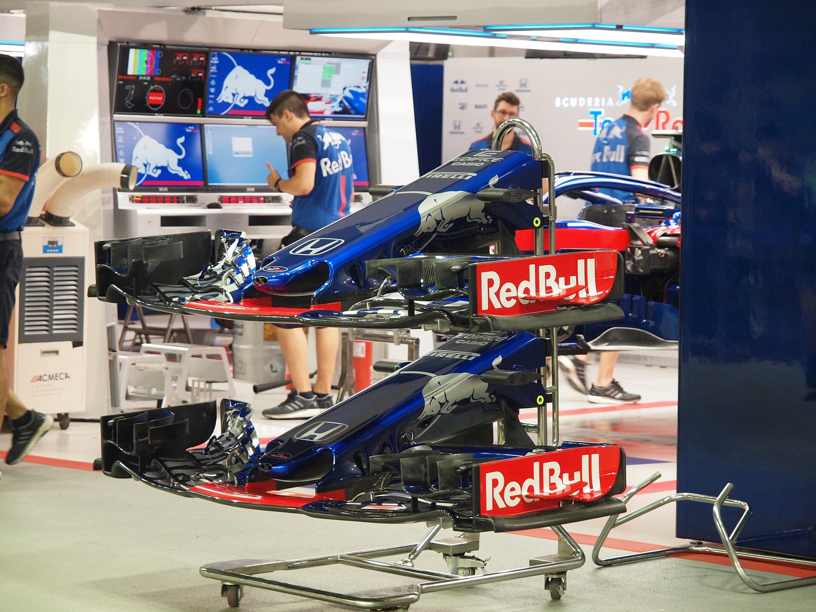 Spare front wings of the Toro Rosso STR13 on a rack in the garage at the 2018 Singapore Grand Prix