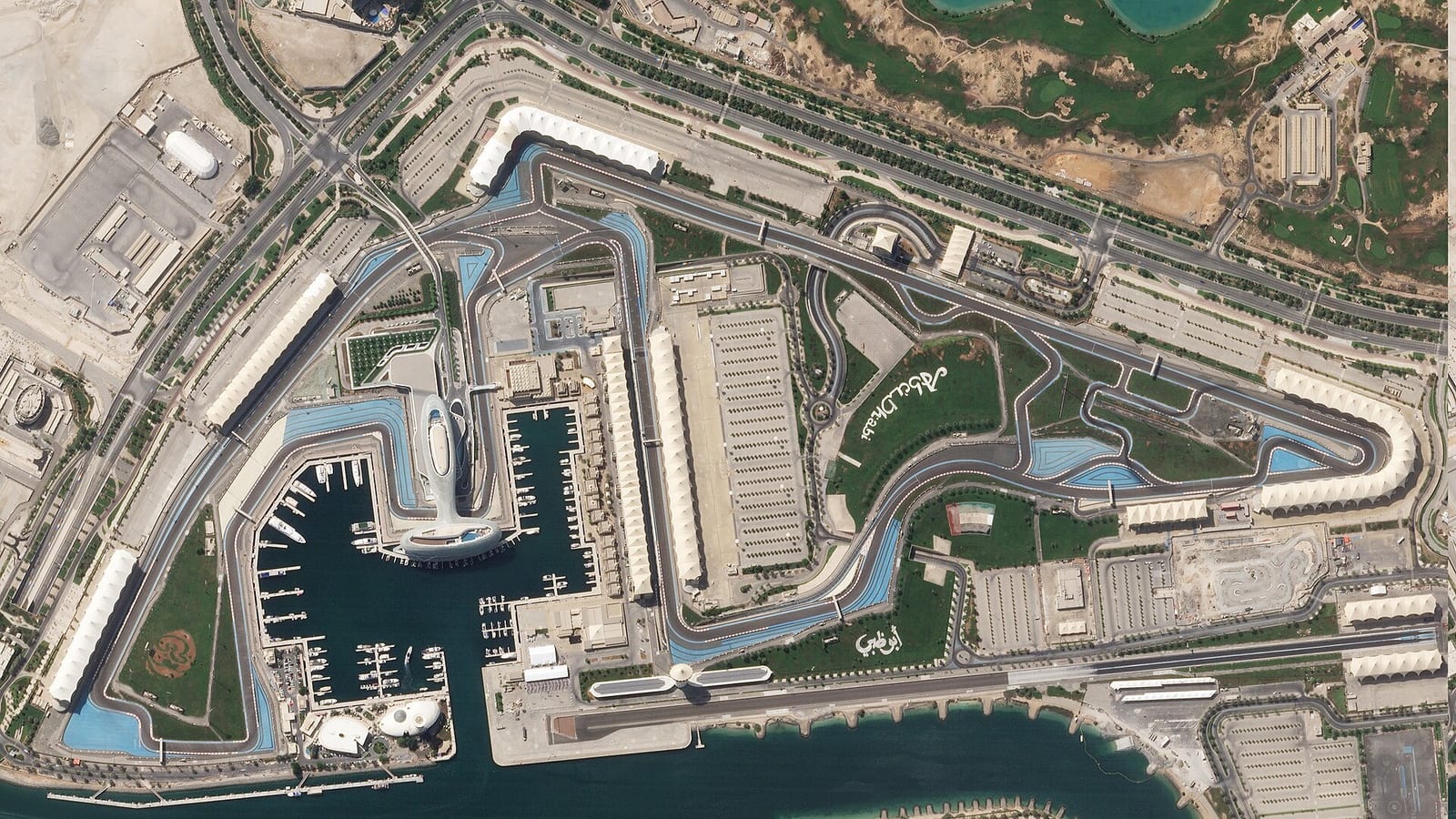 Satellite view of the Yas Marina Circuit in October 2018 with the marina, the hotel over the track and the long straights