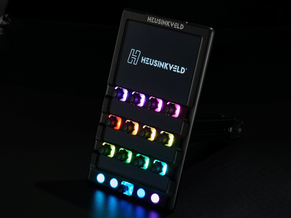 Heusinkveld DisplayDash in the dark with the rotaries and buttons lit in purple, orange, green and blue
