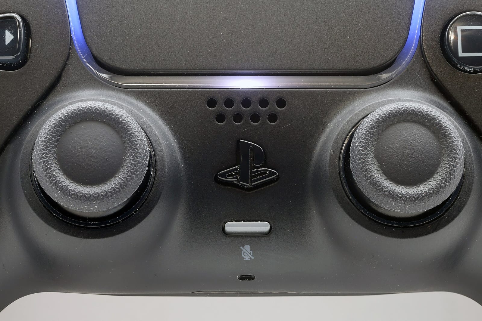 Close view of the two analogue sticks on a PS5 DualSense controller