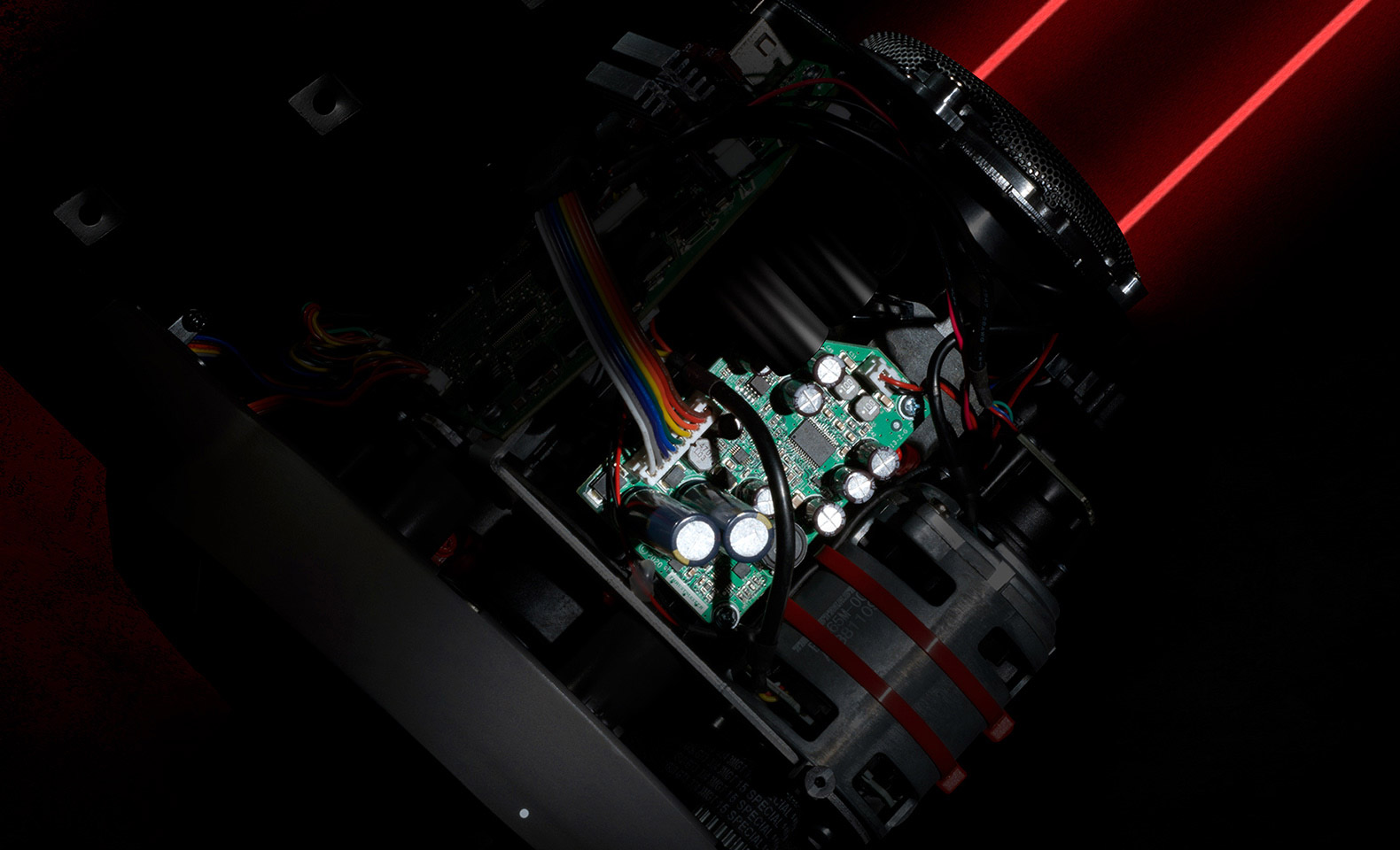Inside the Thrustmaster T-GT II base: the control board next to the brushless motor