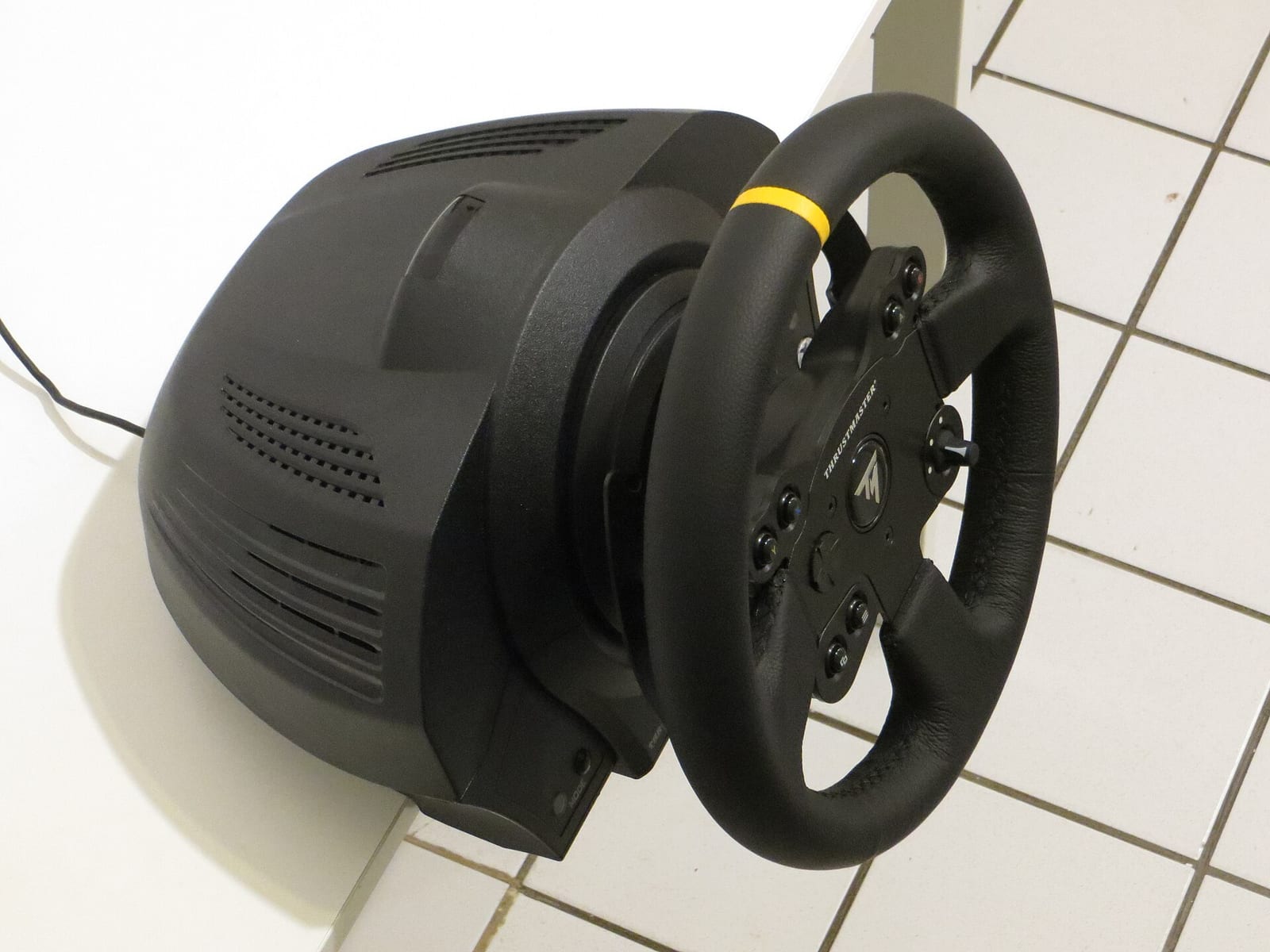 The Thrustmaster TX base and leather rim seen from above, showing the size of the motor housing