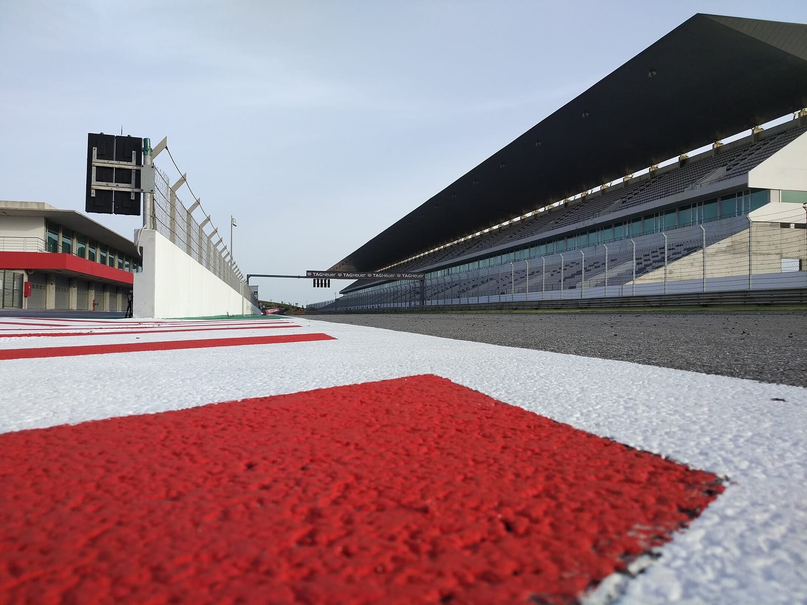 The kerb, pit wall and main grandstand of the Algarve International Circuit in Portimao