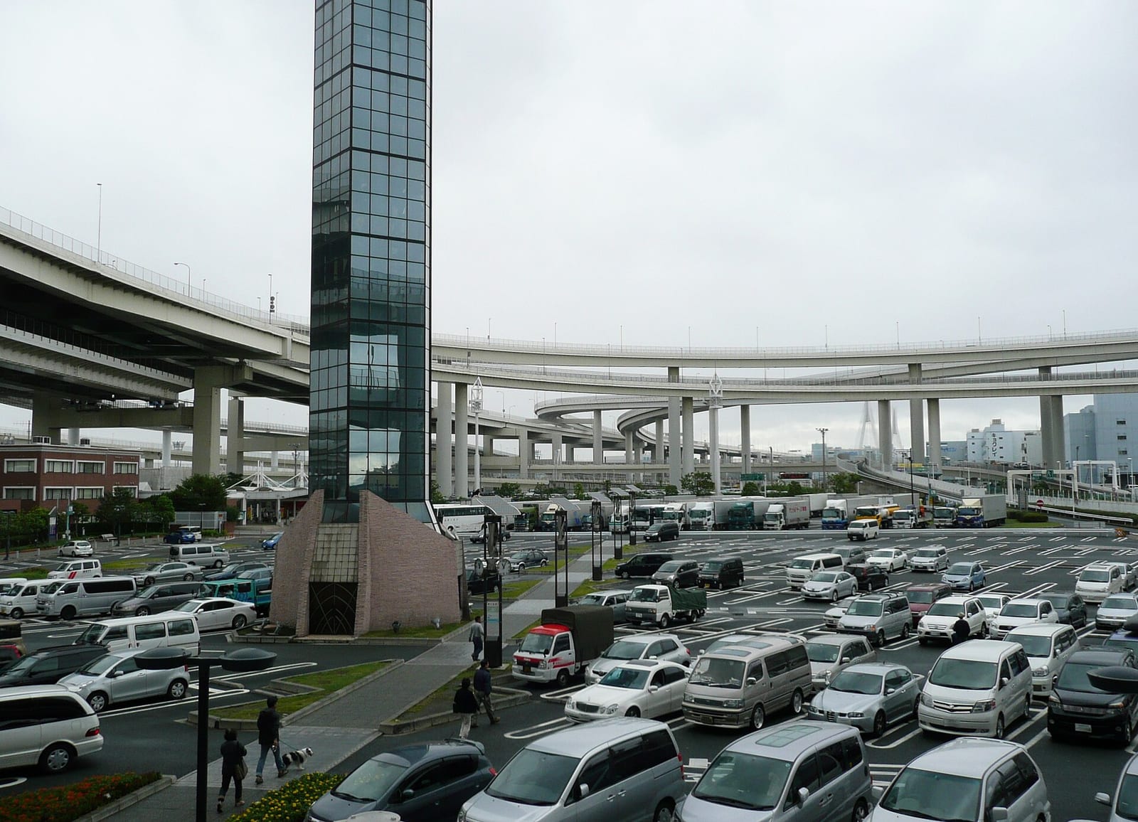 Daikoku parking area on the Shuto Expressway with the spiral ramps of the junction above the car park