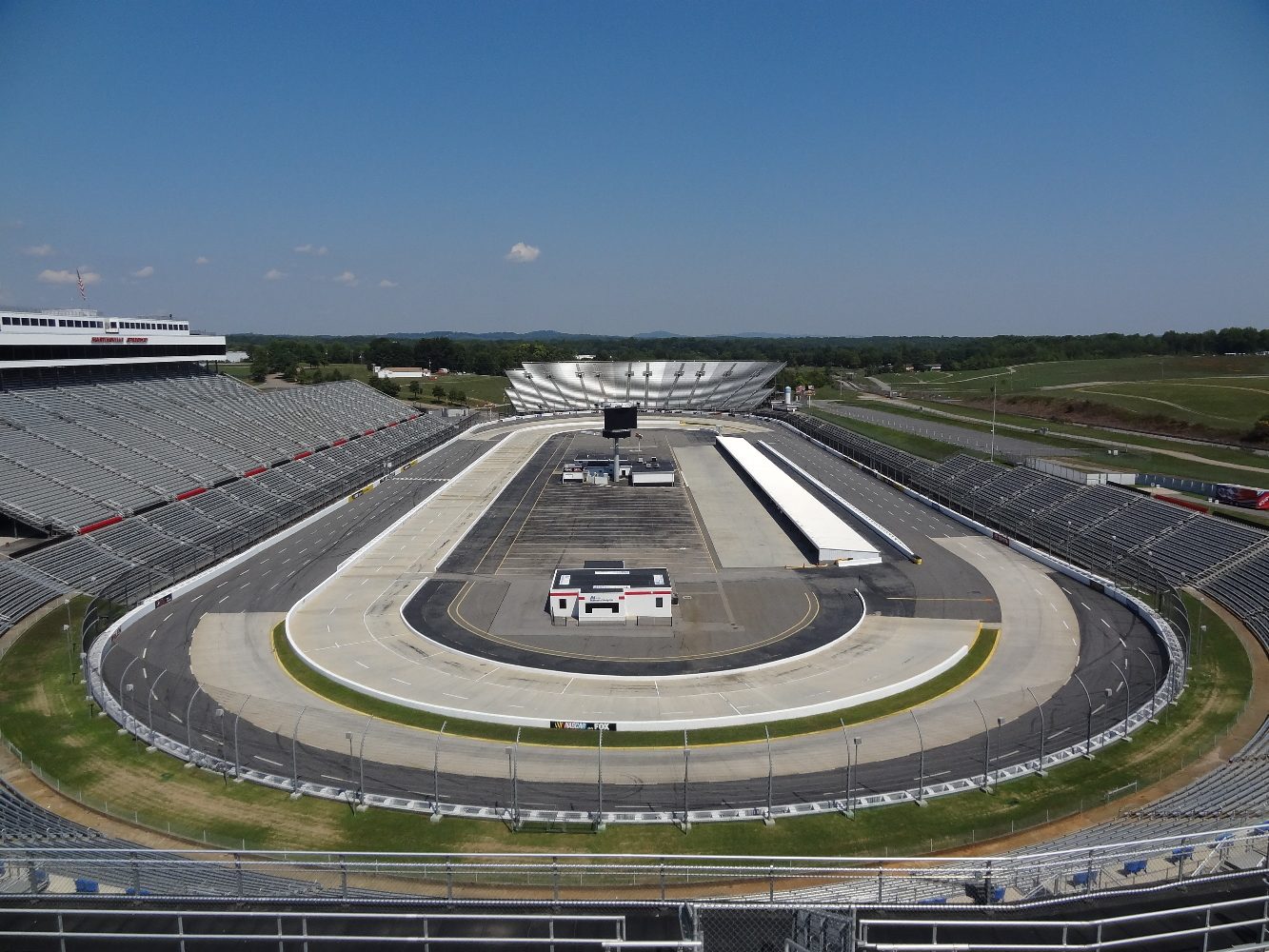 Martinsville Speedway seen from the grandstand at turns 1 and 2, with the concrete in the lower lanes of the turns