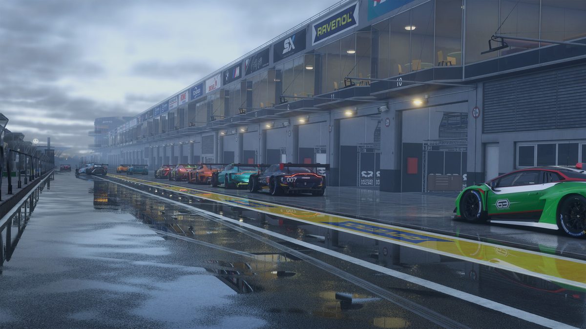 GT cars lined up in a wet pit lane in Project Motor Racing